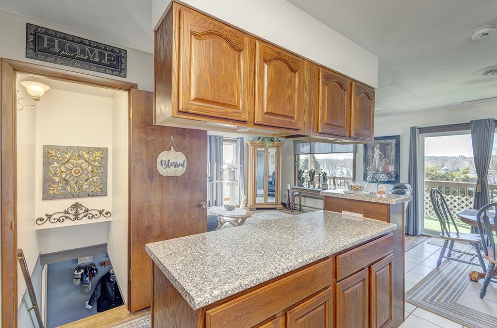 886 Breckenboro Road Davis, IL 61019 - Photo 18 of 37 a kitchen with granite countertop a stove and cabinets
