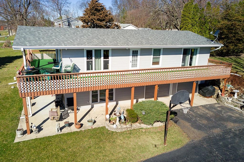 886 Breckenboro Road Davis, IL 61019 - Photo 2 of 37 a view of a house with a patio and a yard