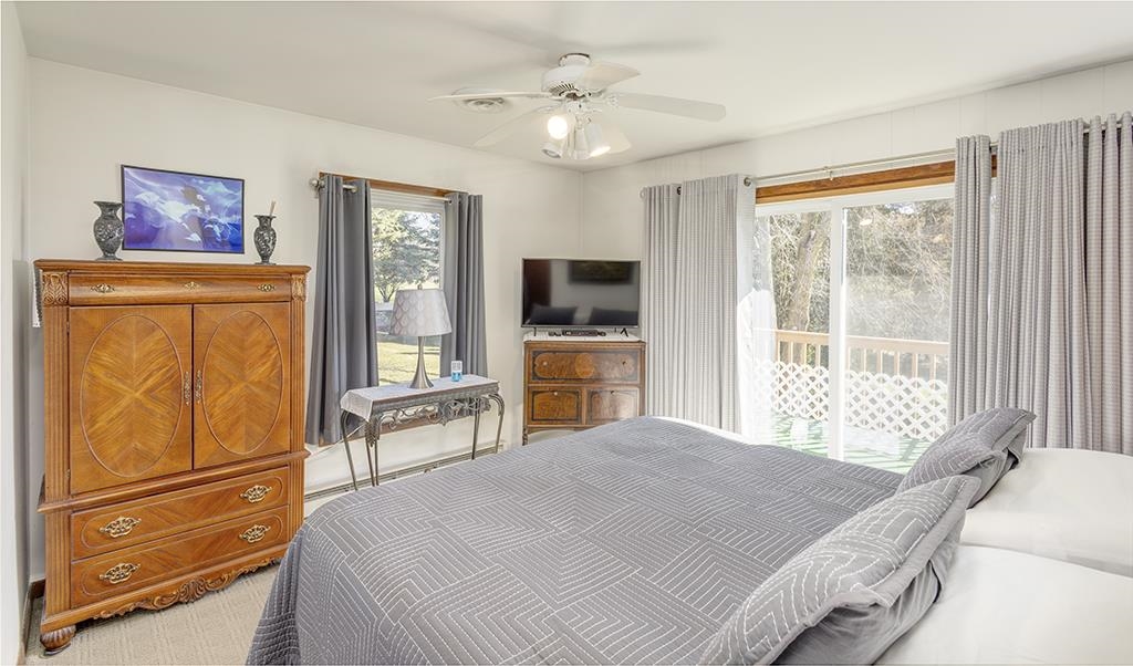 886 Breckenboro Road Davis, IL 61019 - Photo 23 of 37 a bedroom with a large bed and a tv on the dresser