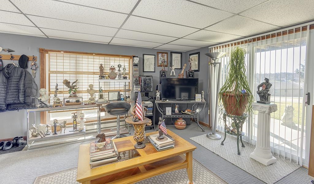 886 Breckenboro Road Davis, IL 61019 - Photo 28 of 37 a living room with large windows