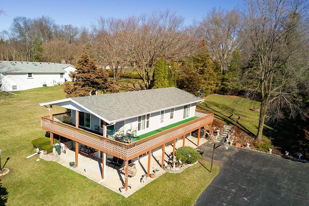 886 Breckenboro Road Davis, IL 61019 - Photo 8 of 37 a view of a house with a big yard and large trees