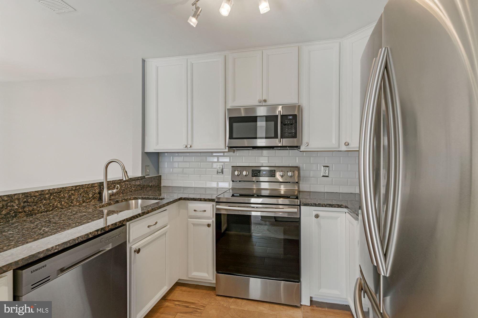 7817 D Harrowgate Circle, Unit 156 Springfield, VA 22152 - Photo 13 of 26 Stainless Appliances and Granite Counters