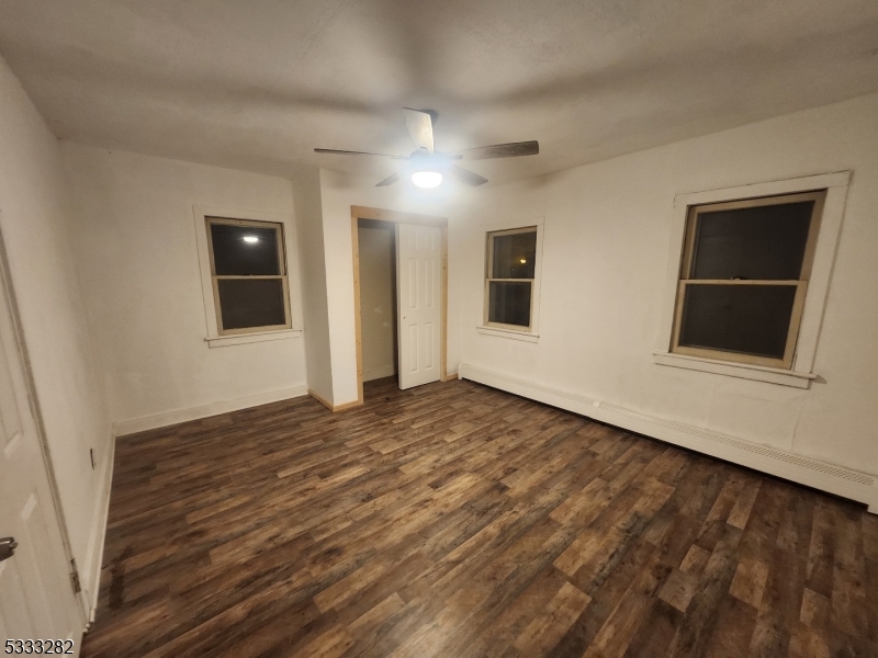 20 Adams Street Belvidere, NJ 07823 - Photo 8 of 11 a view of an empty room with window and wooden floor