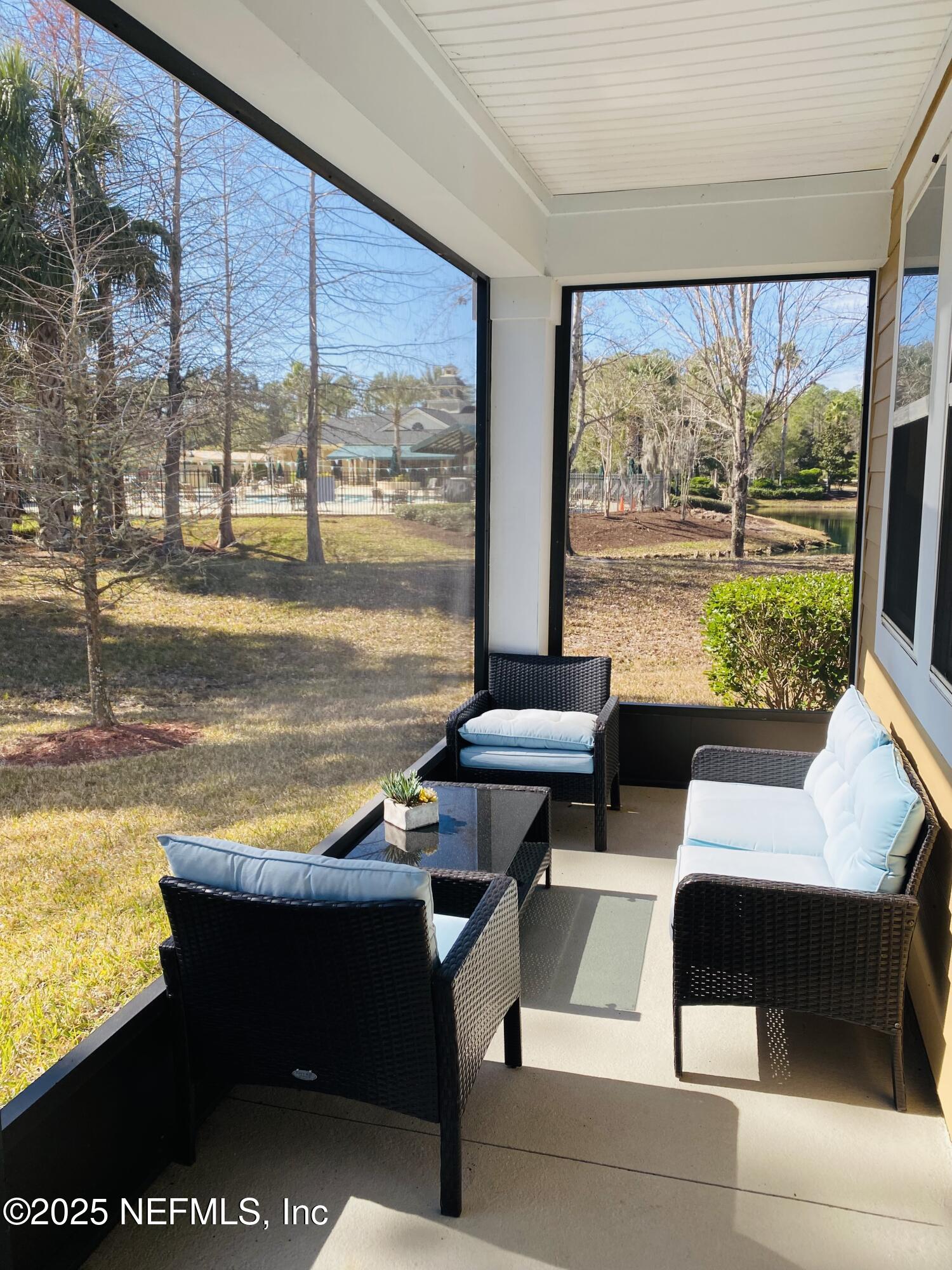 99 Bush Place St. Johns, FL 32259 - Photo 13 of 21 a living room with a large window and yard