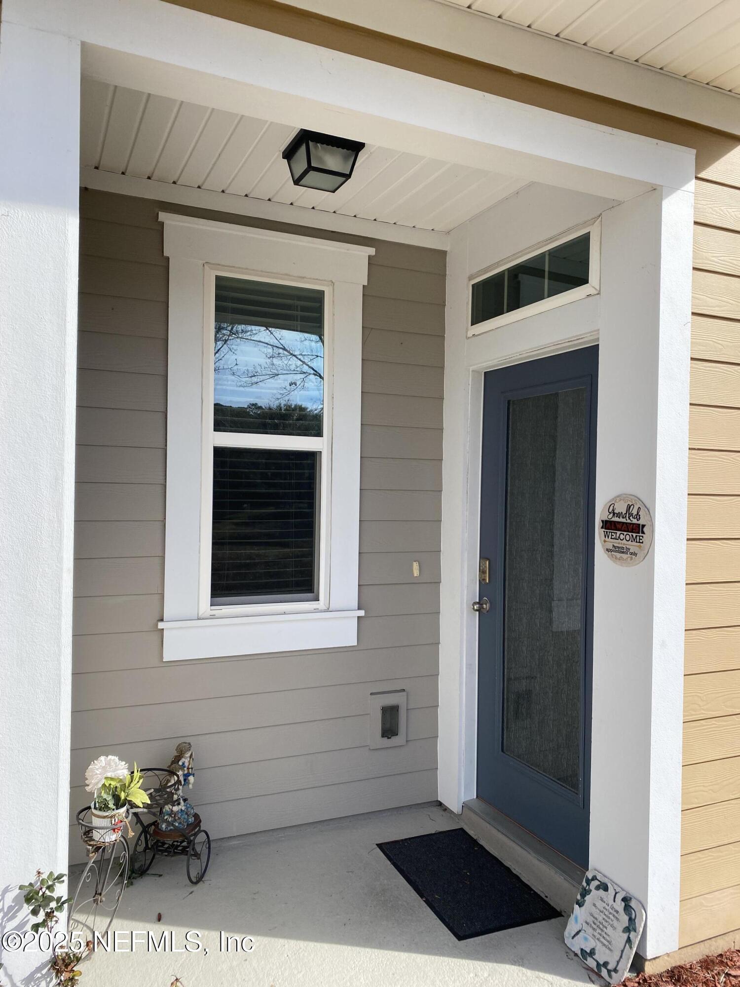 99 Bush Place St. Johns, FL 32259 - Photo 3 of 21 a view of a entryway door of the house
