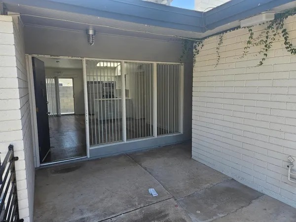 a view of a porch with a door