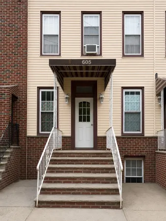 a front view of a house with a large window