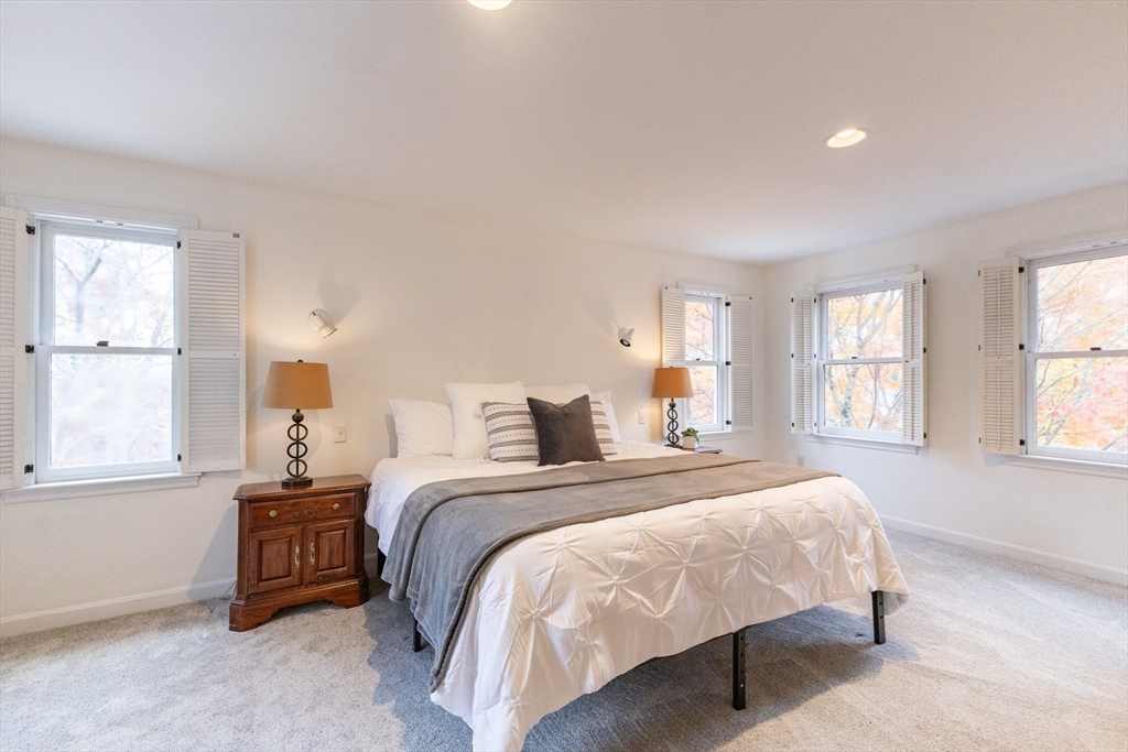 5 Old Wood Road North Attleboro, MA 02760 - Photo 22 of 41 a bedroom with a bed a mirror and a window