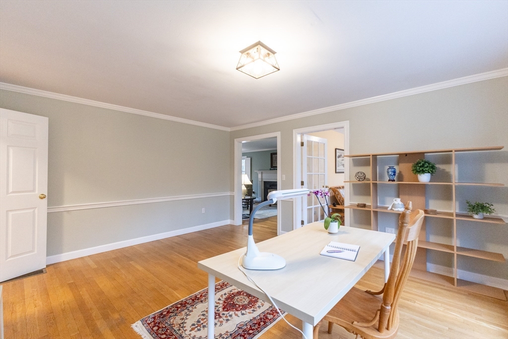 5 Old Wood Road North Attleboro, MA 02760 - Photo 30 of 41 a living room with dining table and a wooden floor