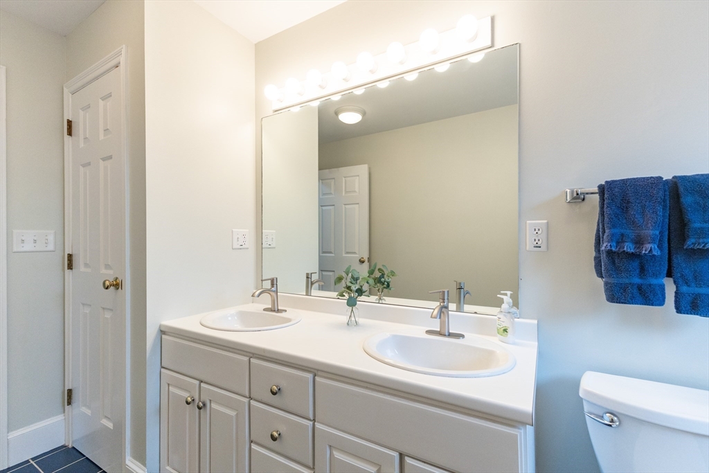 5 Old Wood Road North Attleboro, MA 02760 - Photo 41 of 41 a bathroom with a double vanity sink and a mirror