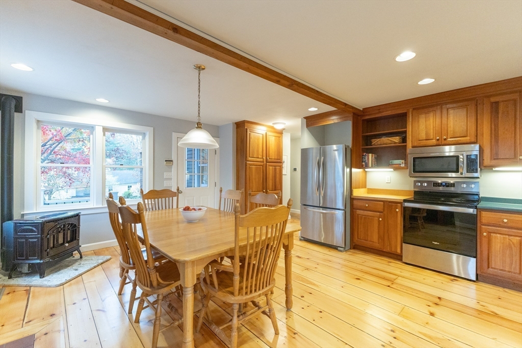 5 Old Wood Road North Attleboro, MA 02760 - Photo 7 of 41 a kitchen with stainless steel appliances kitchen island granite countertop a kitchen island hardwood floor and a sink
