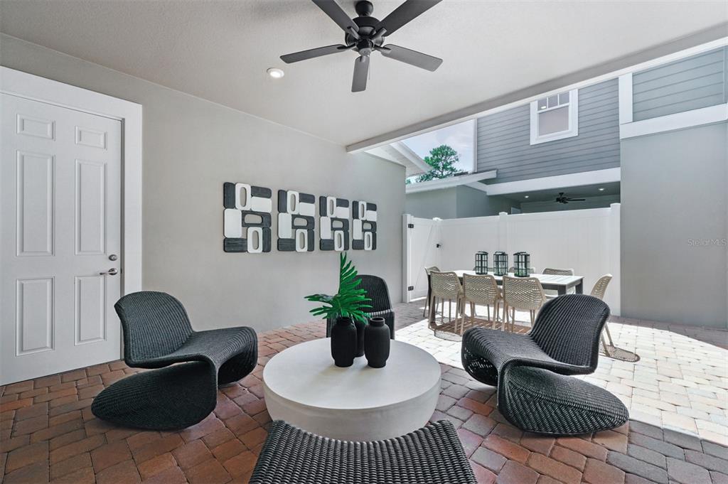 1792 Headland Loop Celebration, FL 34747 - Photo 19 of 31 a living room with furniture rug and wooden floor