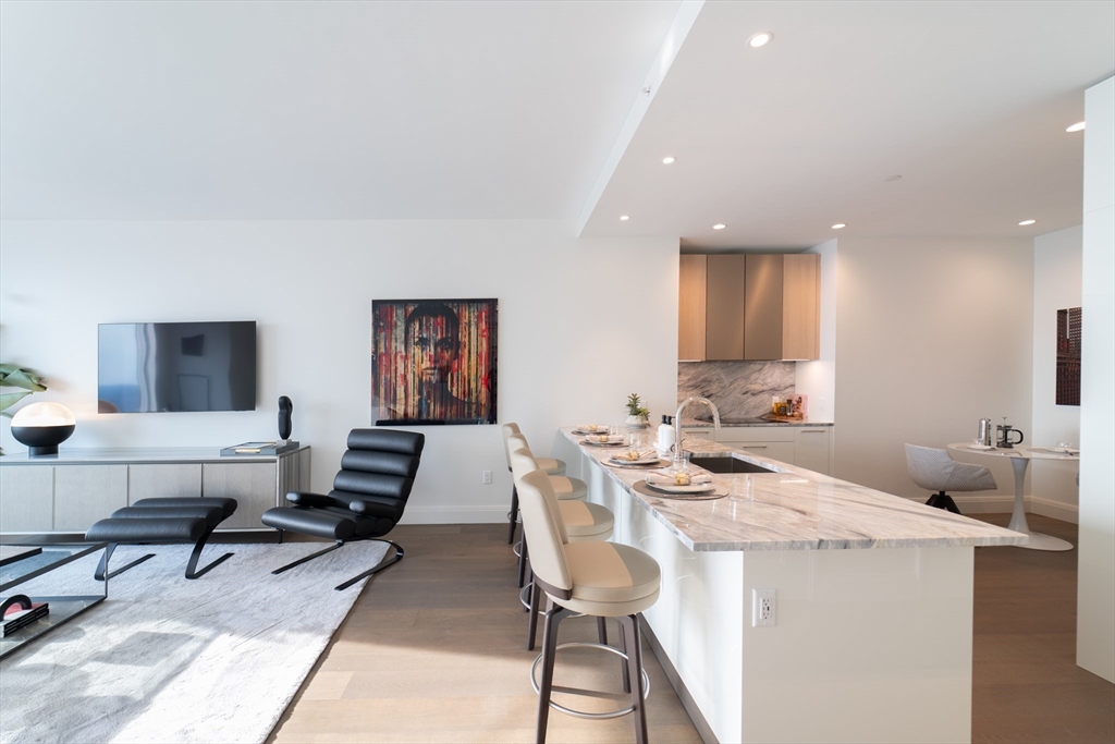 240 Devonshire Street, Unit U5404 Boston, MA 02110 - Photo 5 of 40 a view of a dining room with furniture