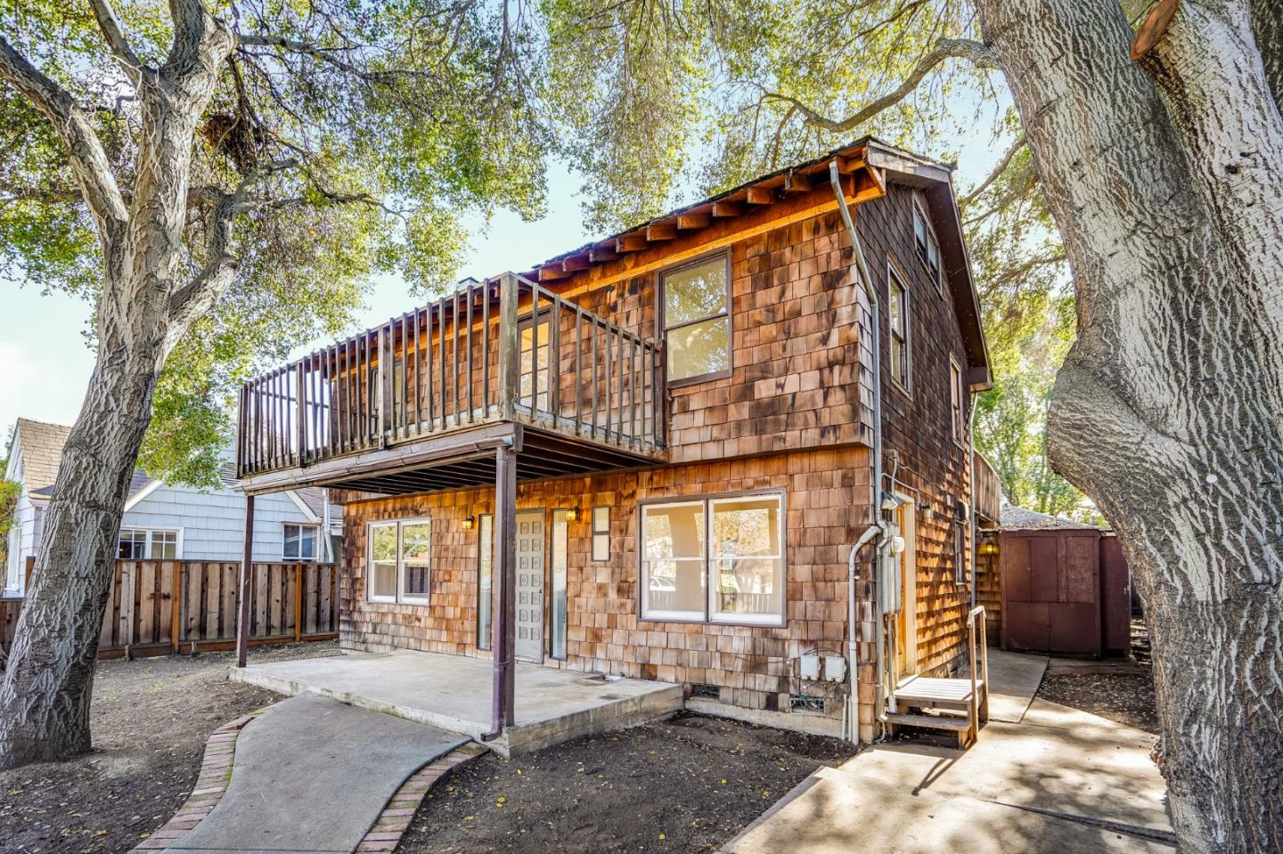 1218 Middlefield Road Palo Alto, CA 94301 - Photo 2 of 31 a view of a house with a iron gate