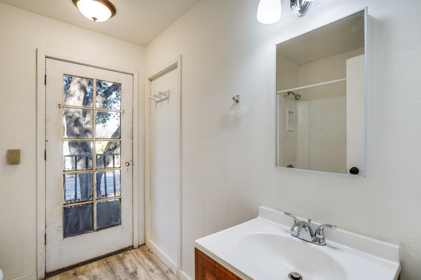 1218 Middlefield Road Palo Alto, CA 94301 - Photo 17 of 31 a bathroom with a sink and a mirror