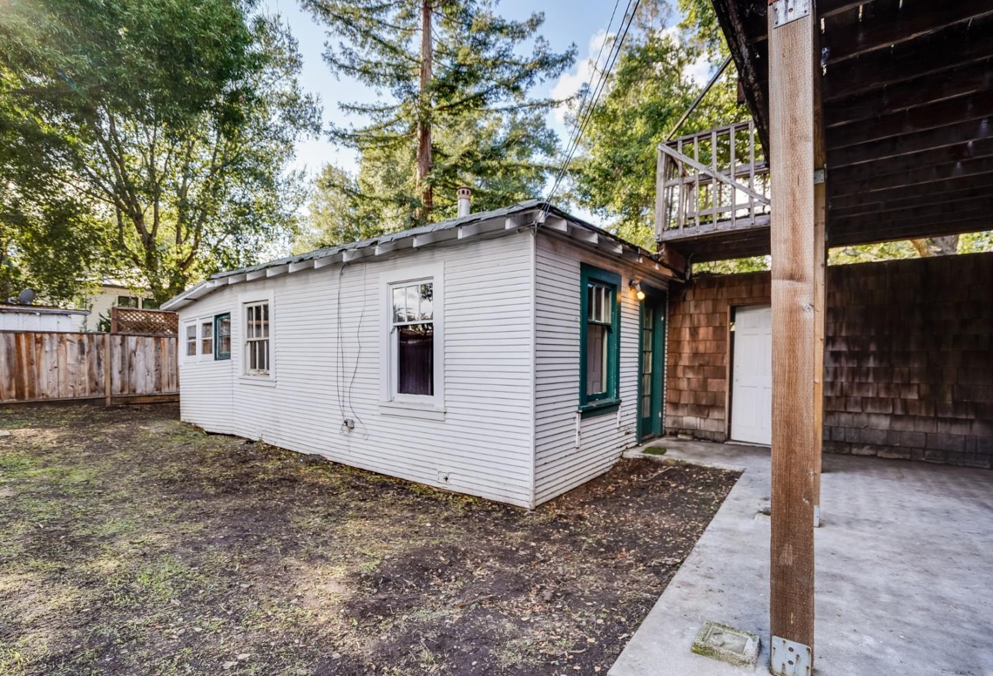 1218 Middlefield Road Palo Alto, CA 94301 - Photo 18 of 31 a white house with a tree in the background