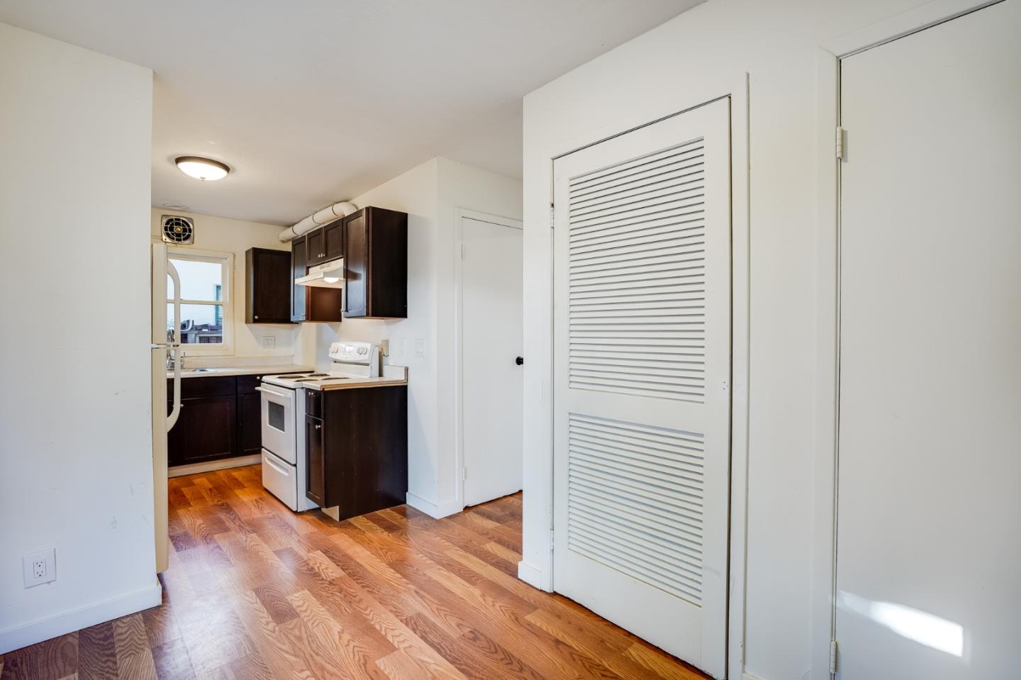 1218 Middlefield Road Palo Alto, CA 94301 - Photo 6 of 31 a bathroom with a sink and a mirror