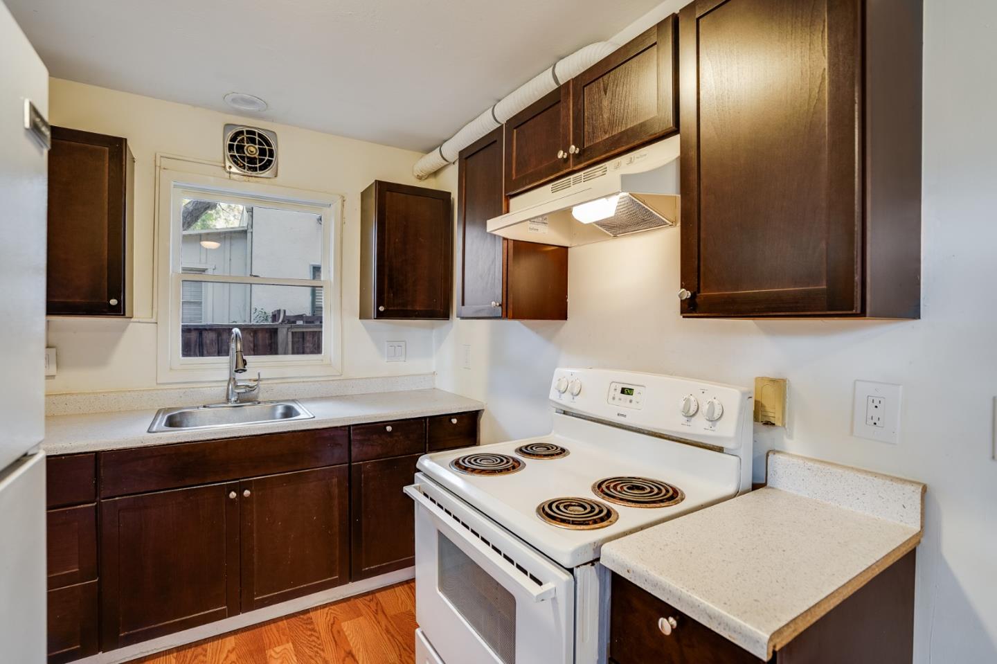 1218 Middlefield Road Palo Alto, CA 94301 - Photo 7 of 31 a kitchen with a sink a stove and cabinets