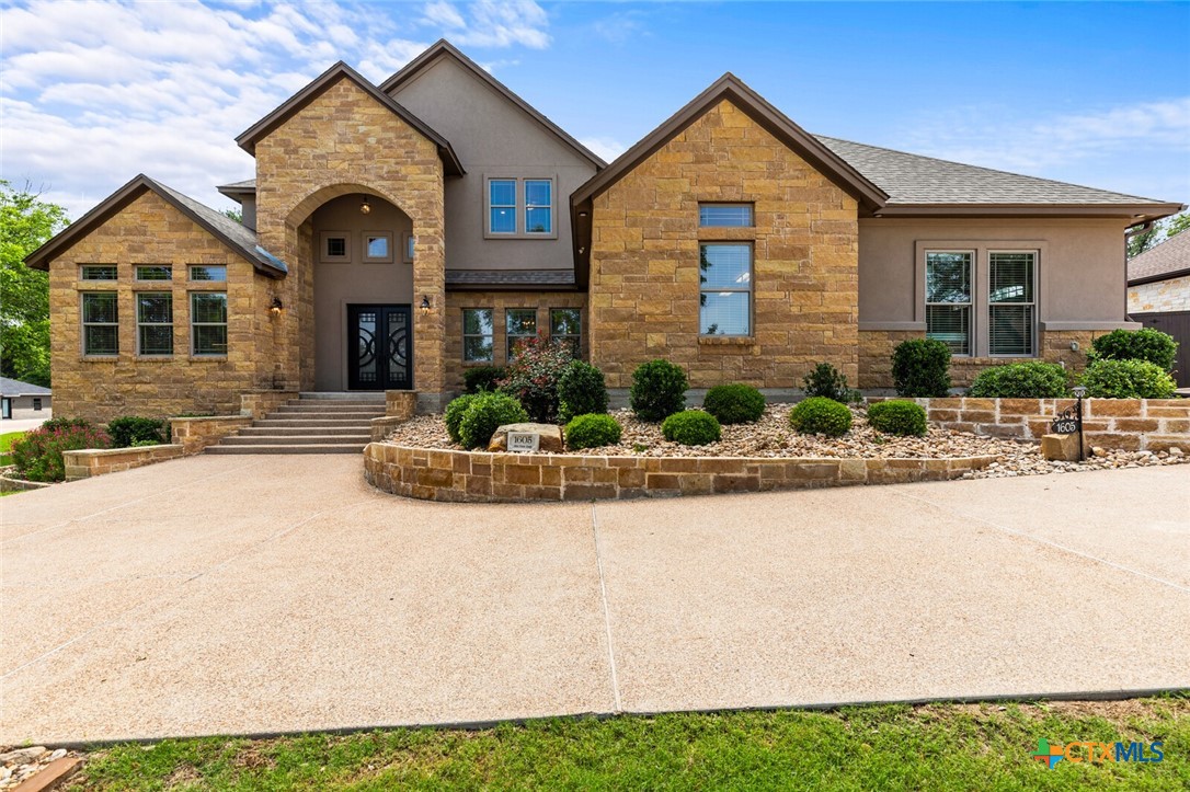 1605 Alta Vista Loop Temple, TX 76502 - Photo 1 of 1 a front view of a house with a yard and garage