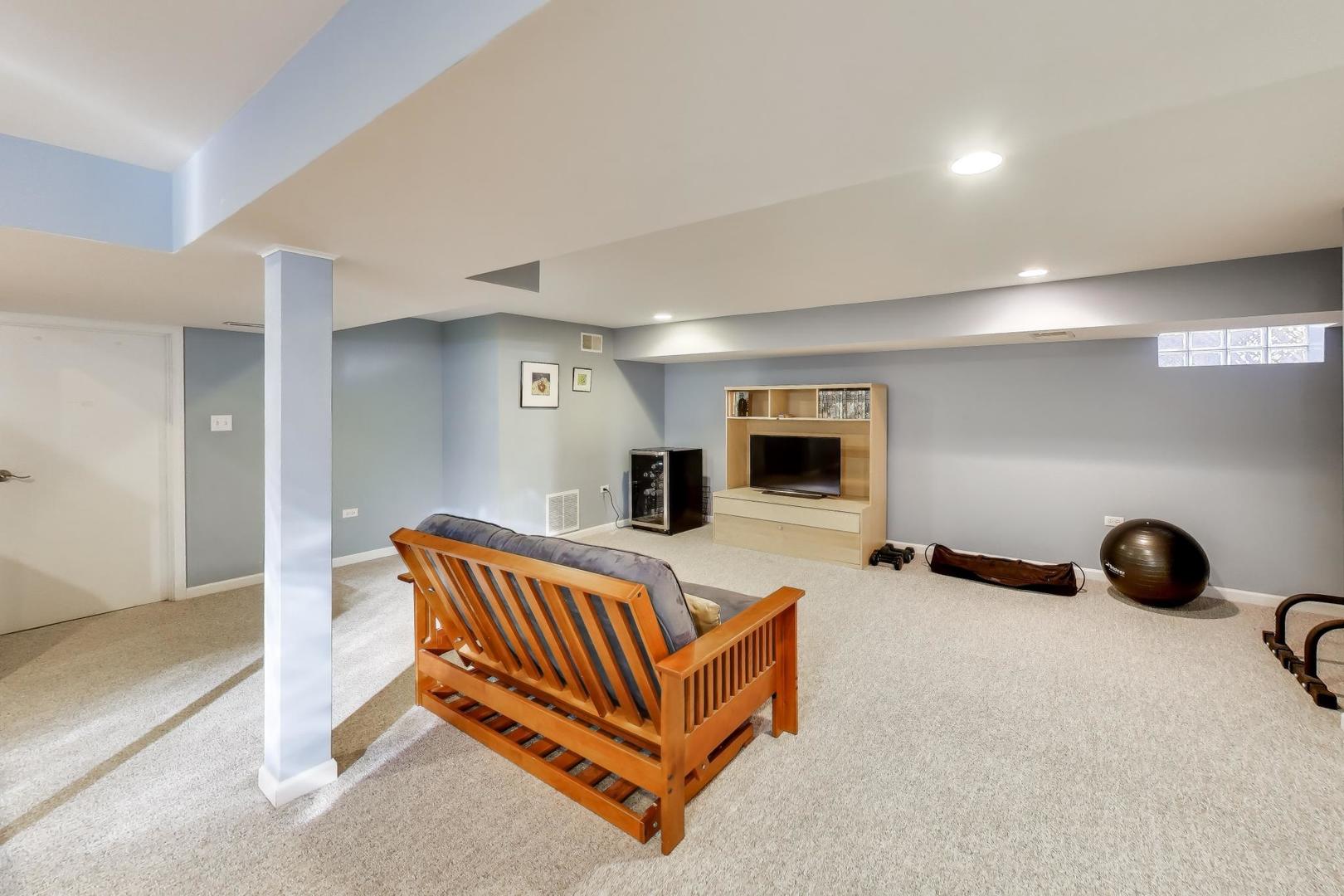 1103 Seward Street Evanston, IL 60202 - Photo 26 of 39 a living room with furniture gym equipment and a view of living room
