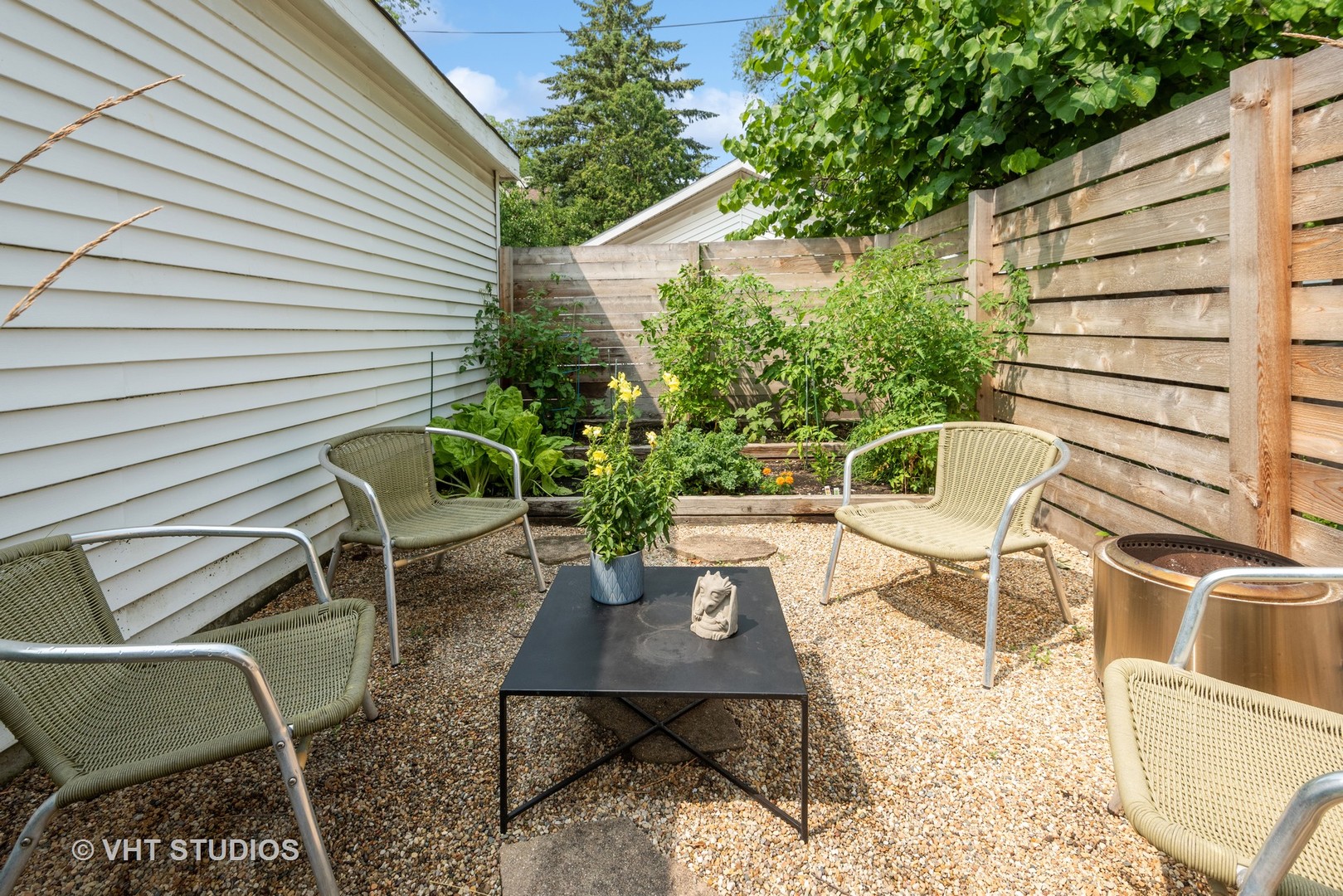 1103 Seward Street Evanston, IL 60202 - Photo 32 of 39 a view of a chair and table in backyard
