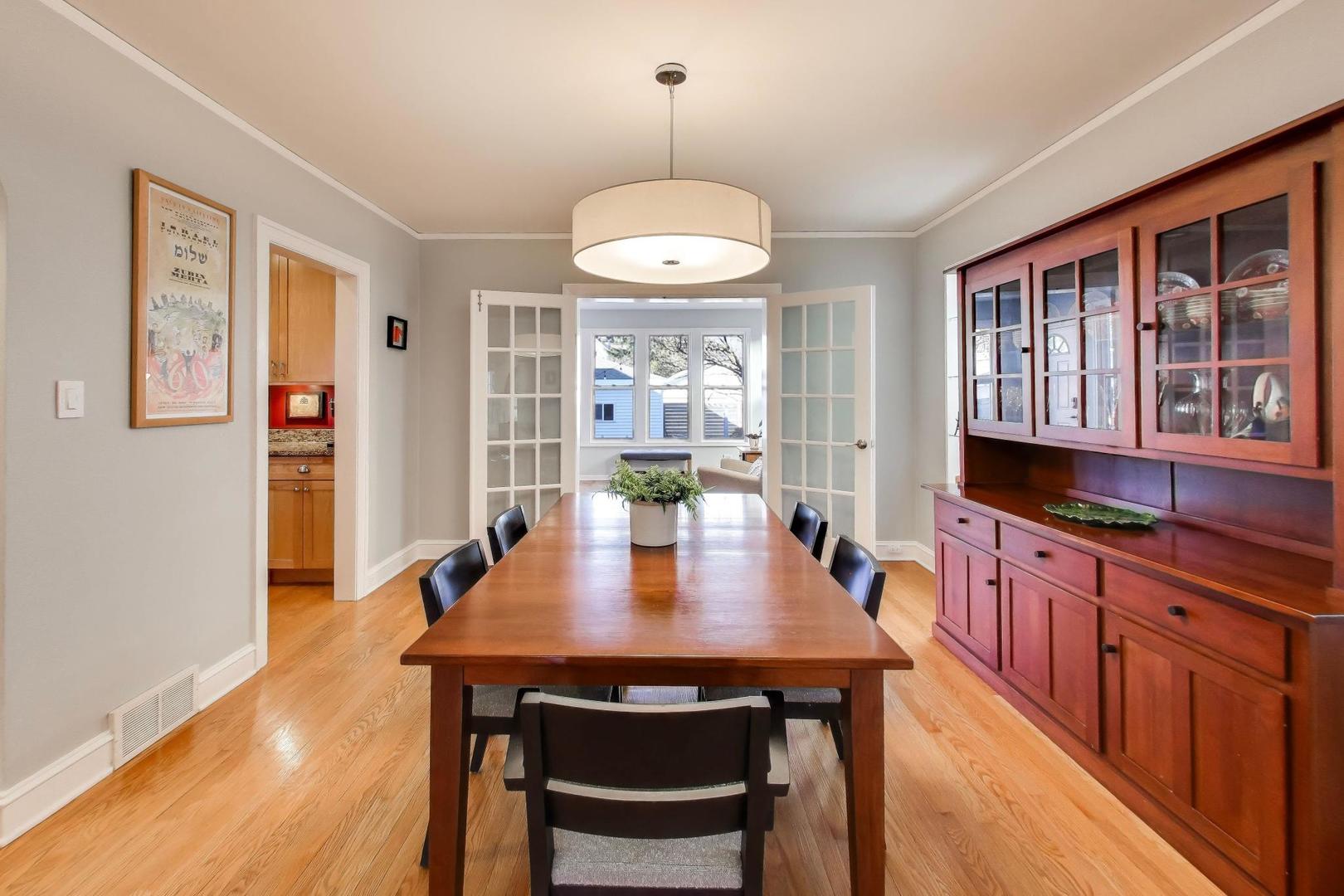 1103 Seward Street Evanston, IL 60202 - Photo 8 of 39 a view of a dining room with furniture window and wooden floor