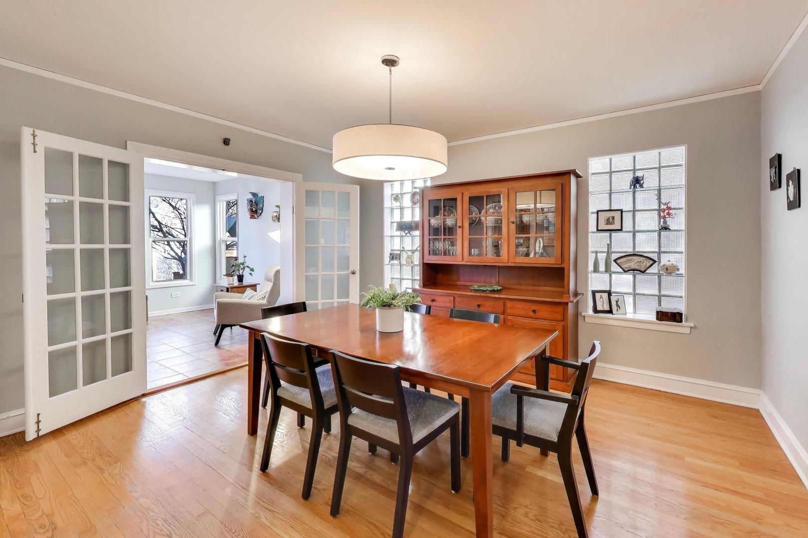 1103 Seward Street Evanston, IL 60202 - Photo 10 of 39 a view of a dining room with furniture window and wooden floor