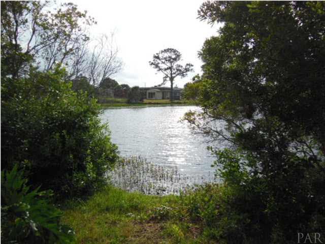 5590 Ponte Verde Road Pensacola, FL 32507 - Photo 3 of 22 A view of the lake from the back yard.
