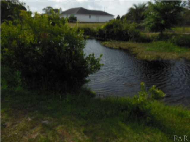5590 Ponte Verde Road Pensacola, FL 32507 - Photo 5 of 22 The inlet to the lake which runs down the south side of the house