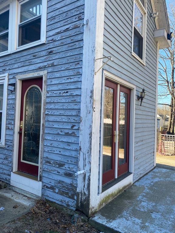 66 Main Street, Unit C Blackstone, MA 01504 - Photo 13 of 35 a view of front door of house
