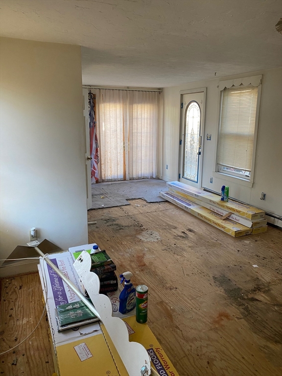 66 Main Street, Unit C Blackstone, MA 01504 - Photo 14 of 35 a view of a livingroom with storage