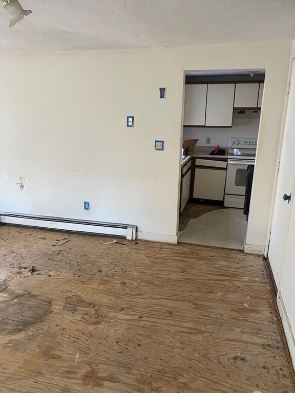 66 Main Street, Unit C Blackstone, MA 01504 - Photo 15 of 35 a view of a kitchen and an empty room