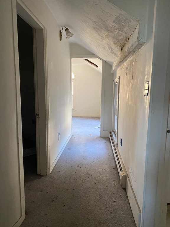 66 Main Street, Unit C Blackstone, MA 01504 - Photo 20 of 35 a view of a hallway with wooden shelves