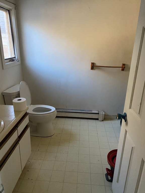 66 Main Street, Unit C Blackstone, MA 01504 - Photo 21 of 35 a bathroom with a sink and a toilet