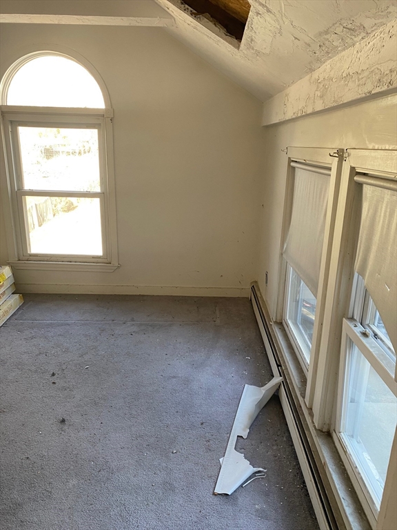 66 Main Street, Unit C Blackstone, MA 01504 - Photo 25 of 35 an empty room with windows