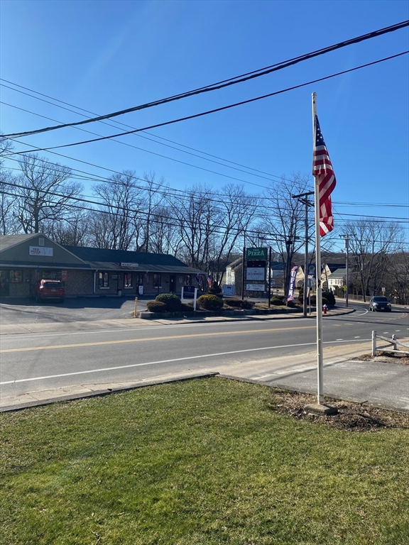 66 Main Street, Unit C Blackstone, MA 01504 - Photo 5 of 35 a view of a street with a building