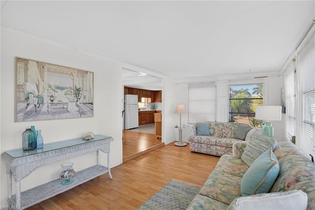 101 Rookery Road Naples, FL 34114 - Photo 16 of 43 a living room with furniture and wooden floor
