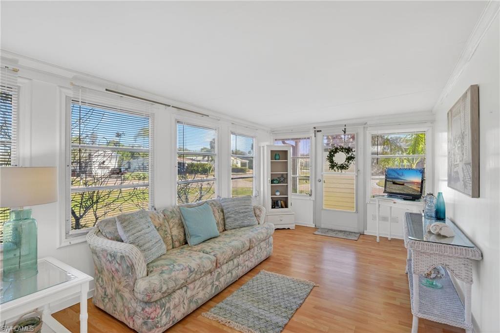 101 Rookery Road Naples, FL 34114 - Photo 17 of 43 a living room with furniture and a large window