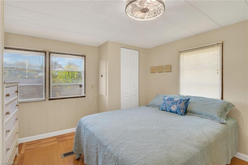 101 Rookery Road Naples, FL 34114 - Photo 19 of 43 a bedroom with a bed and a window
