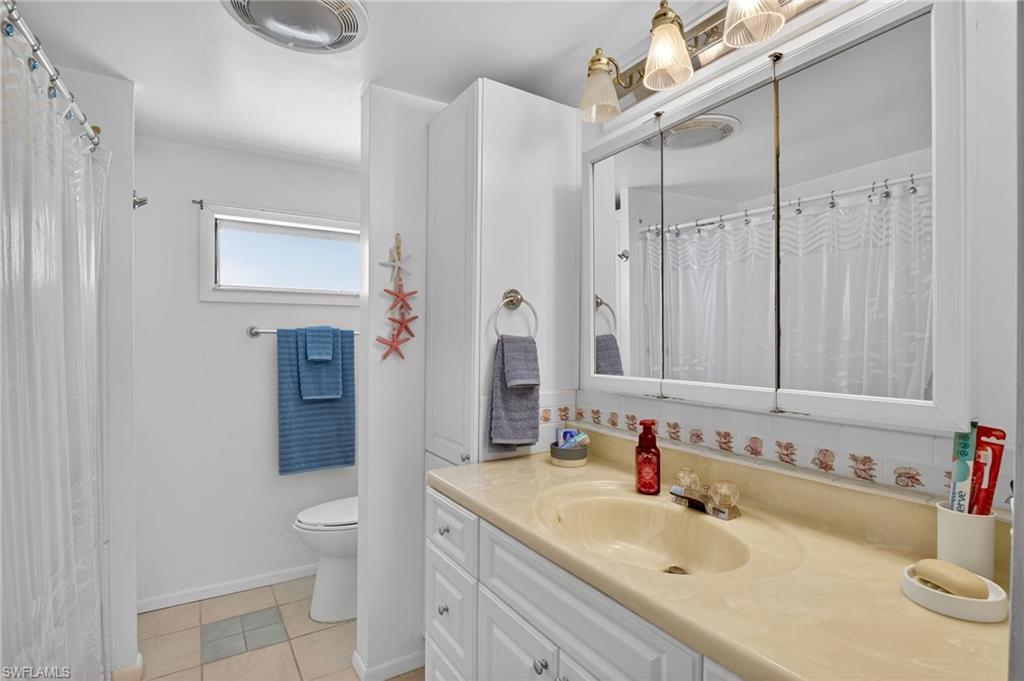 101 Rookery Road Naples, FL 34114 - Photo 21 of 43 a bathroom with a sink toilet and shower