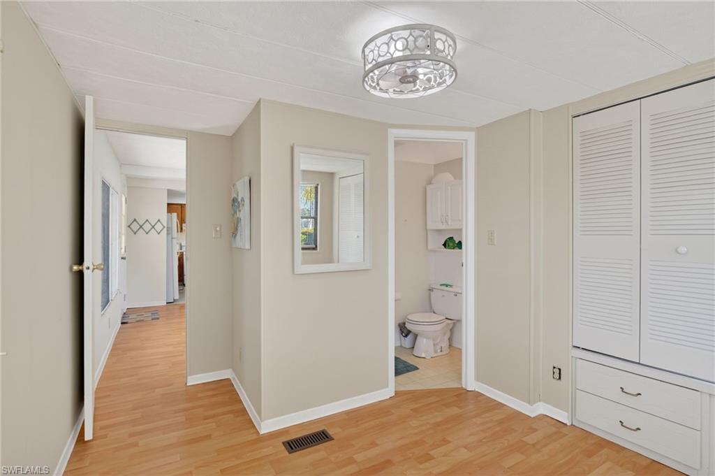 101 Rookery Road Naples, FL 34114 - Photo 23 of 43 a view of a room with wooden floor