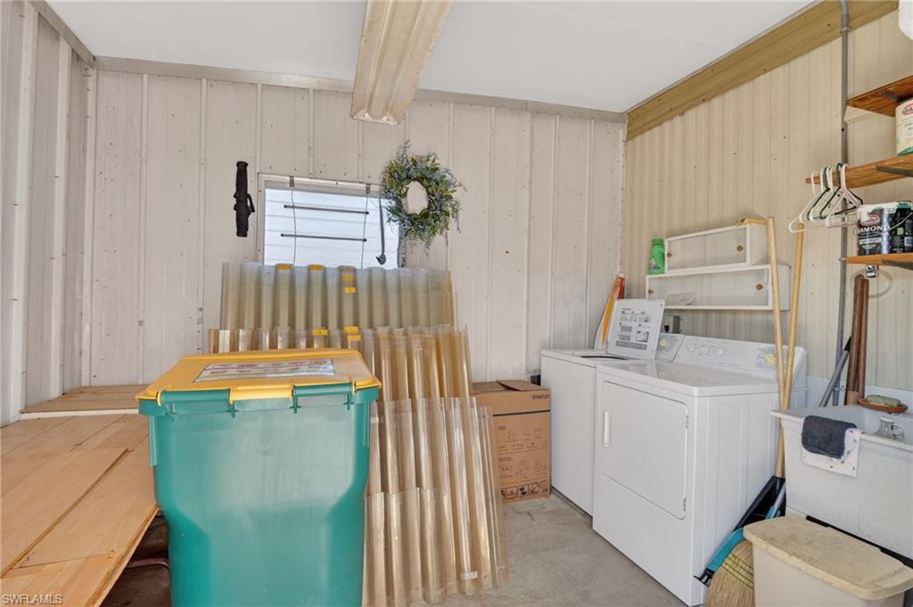 101 Rookery Road Naples, FL 34114 - Photo 26 of 43 a utility room with dryer and washer