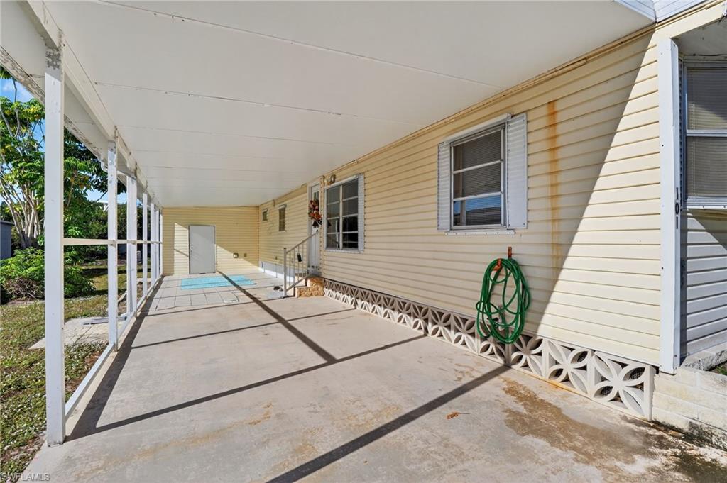 101 Rookery Road Naples, FL 34114 - Photo 27 of 43 a view of a house with a backyard