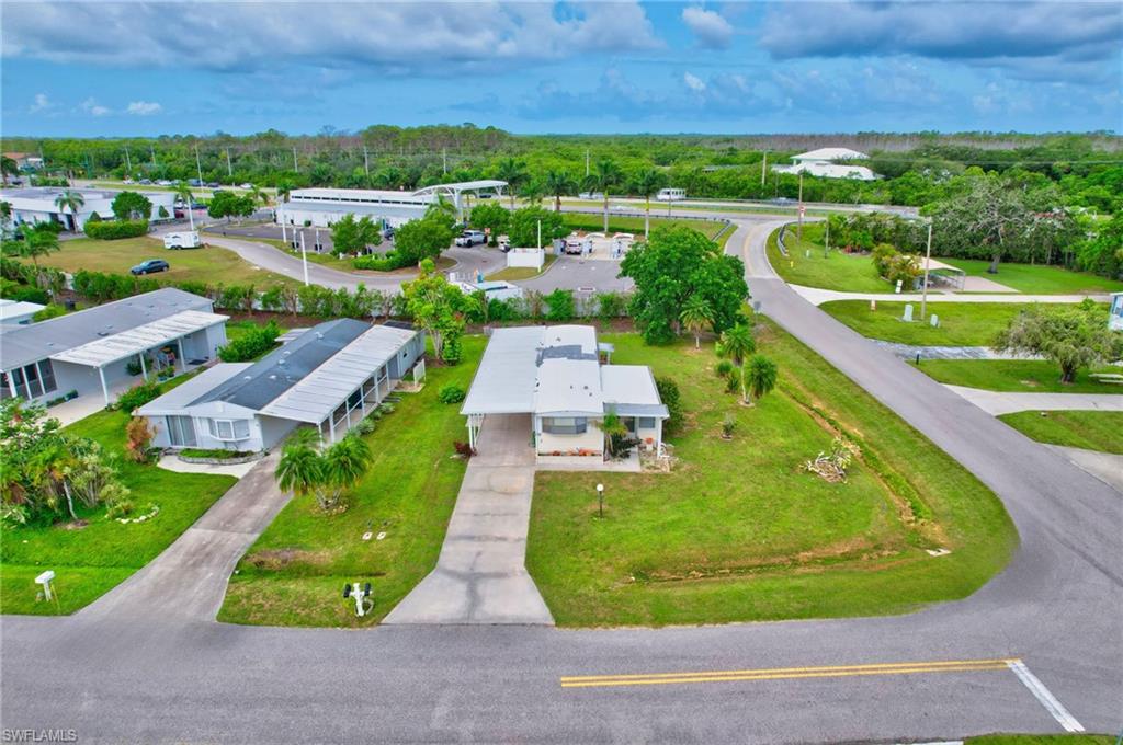 101 Rookery Road Naples, FL 34114 - Photo 32 of 43 an aerial view of a house with a garden and trees