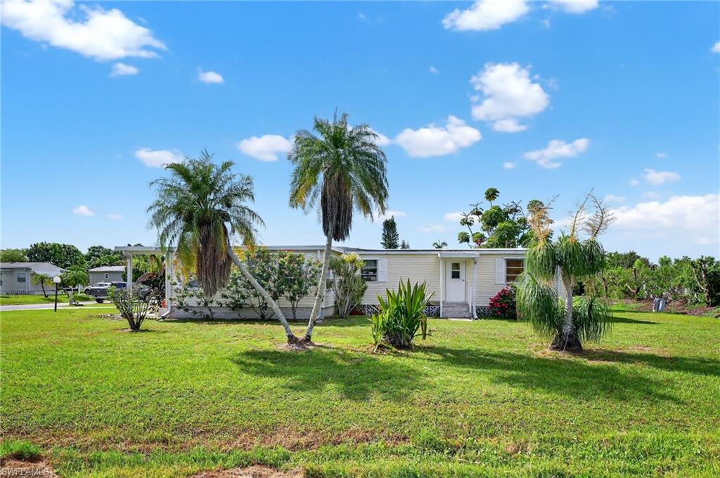 101 Rookery Road Naples, FL 34114 - Photo 35 of 43 a view of a house with a backyard