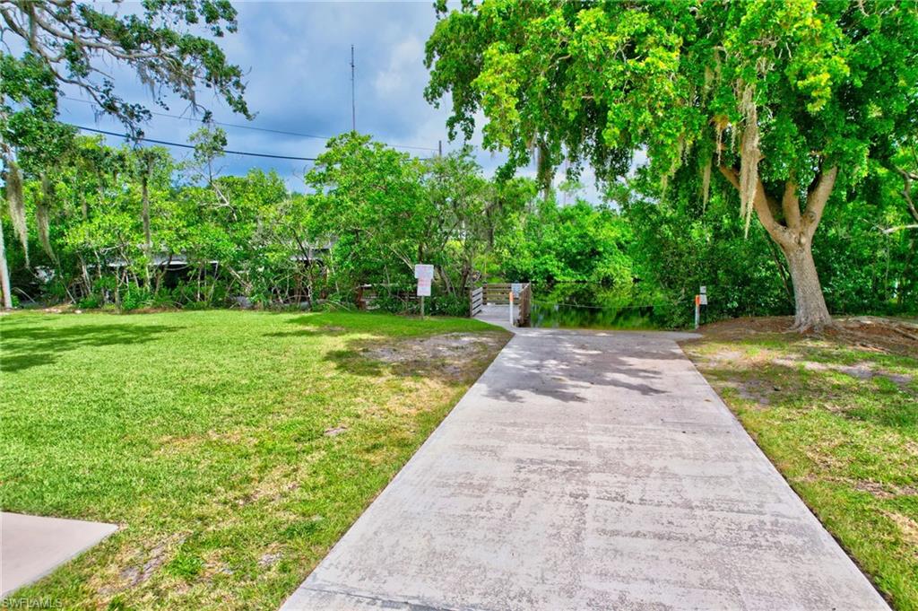 101 Rookery Road Naples, FL 34114 - Photo 38 of 43 a view of a yard with plants