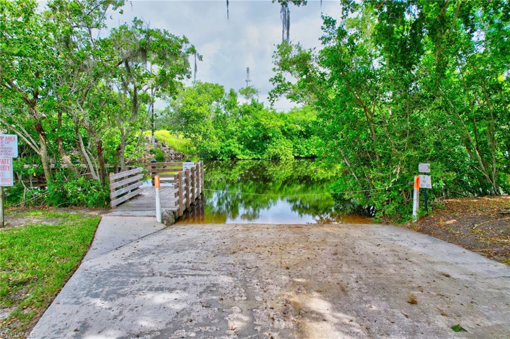101 Rookery Road Naples, FL 34114 - Photo 39 of 43 a view of a road with a trees