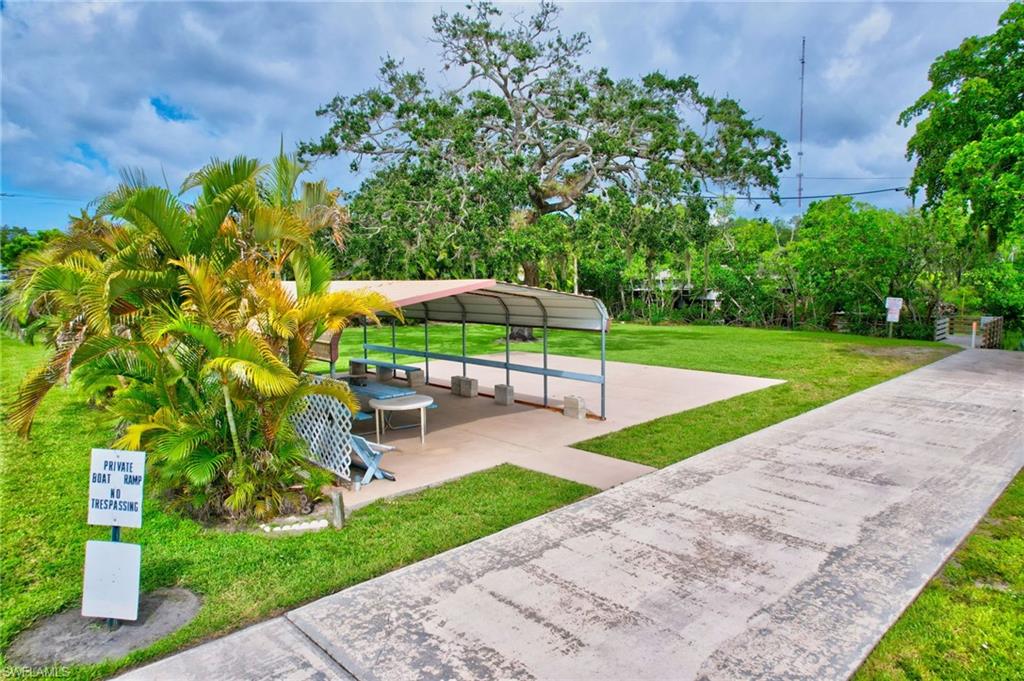 101 Rookery Road Naples, FL 34114 - Photo 41 of 43 a view of a garden with a slide