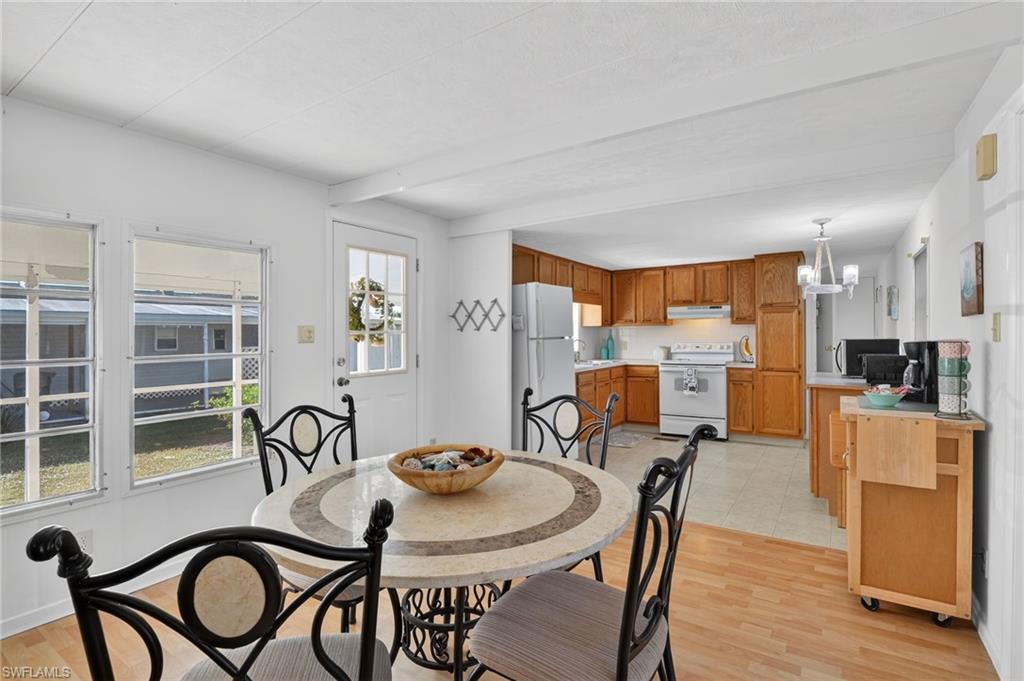 101 Rookery Road Naples, FL 34114 - Photo 5 of 43 a dining room with furniture and window
