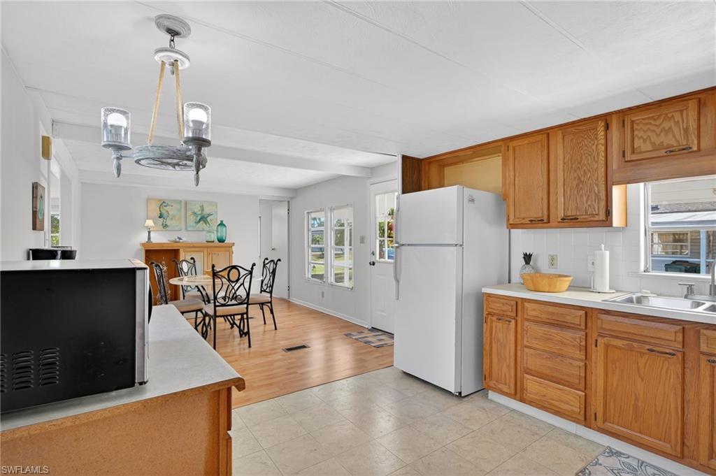 101 Rookery Road Naples, FL 34114 - Photo 8 of 43 a view of a kitchen and dining room